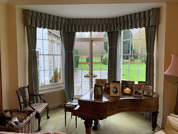 curtains and grand piano